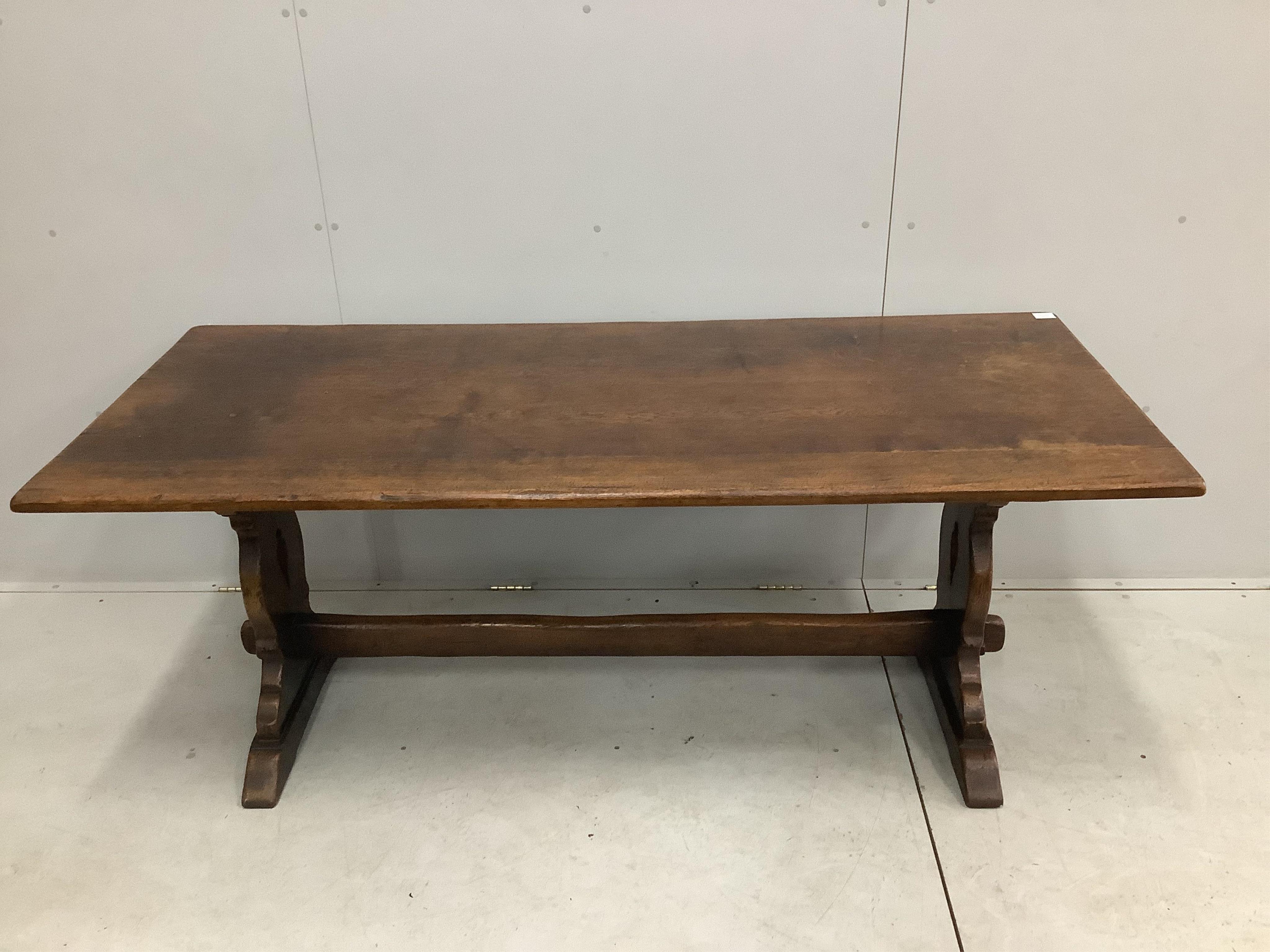 A set of six 18th century style oak ladder back dining chairs with rush seats, height of carvers 124cm, width of carvers 54cm and a 17th century style oak refectory table, width 183cm wide, depth, height 73cm. Condition